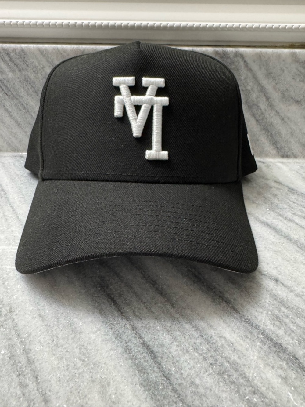 New Era Black 9FORTY Snapback Hat with White Logo Accents